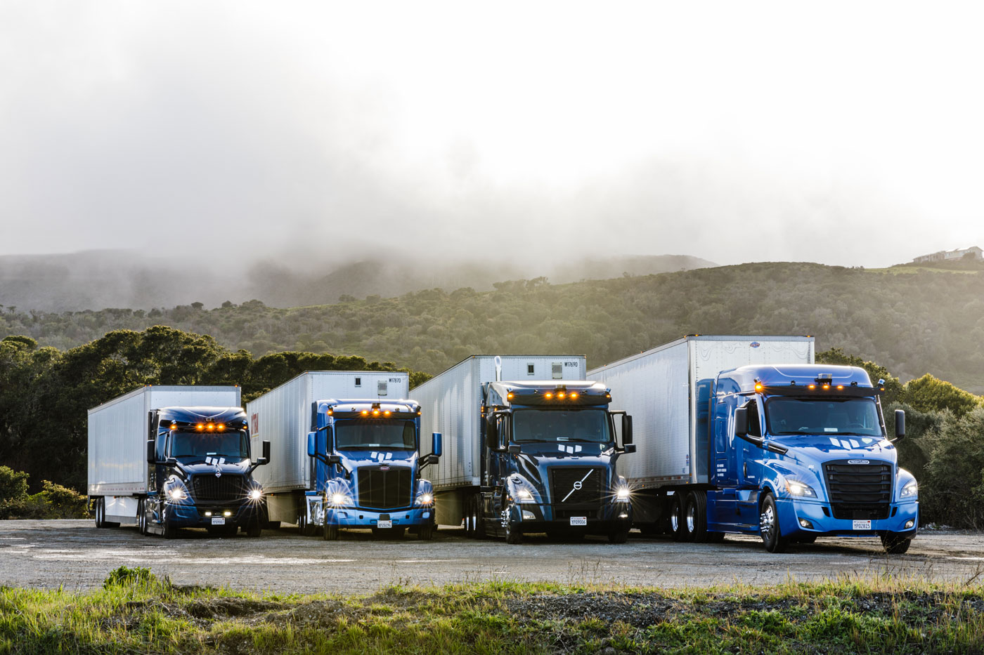 Photo of 4 embark trucks made by different OEMs.